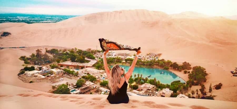 From Lima: Full Day to Paracas and Huacachina Desert Oasis - Huacachina Oasis: calm lake views before the sand chaos